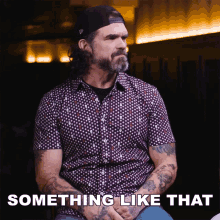 a man in a polka dot shirt has something like that written on the bottom